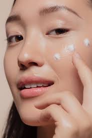 Simple skincare routine with cleanser, moisturizer, sunscreen, and serum for healthy glowing skin